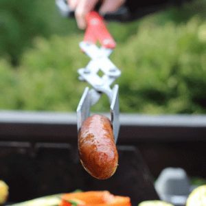 BBQ Croc by Croc Tools easily grabs a sausage on the barbecue.