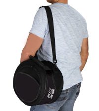 BBQ Croc all-in-one COOL GRILL cooler & portable charcoal grill using the shoulder strap to carry it over a mans shoulder.