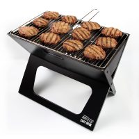 BBQ Croc foldable charcoal X-style grill with 12 burgers cooking on its grill, illustrating how big the grill is.