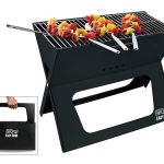 BBQ Croc foldable charcoal X-style grill assembled with the grill lifter in place and three BBQ Croc Zig Zag Skewers cooking on the grill, on the lower left in a square is a photo of the grill folded and being carried like a briefcase, all on white background.